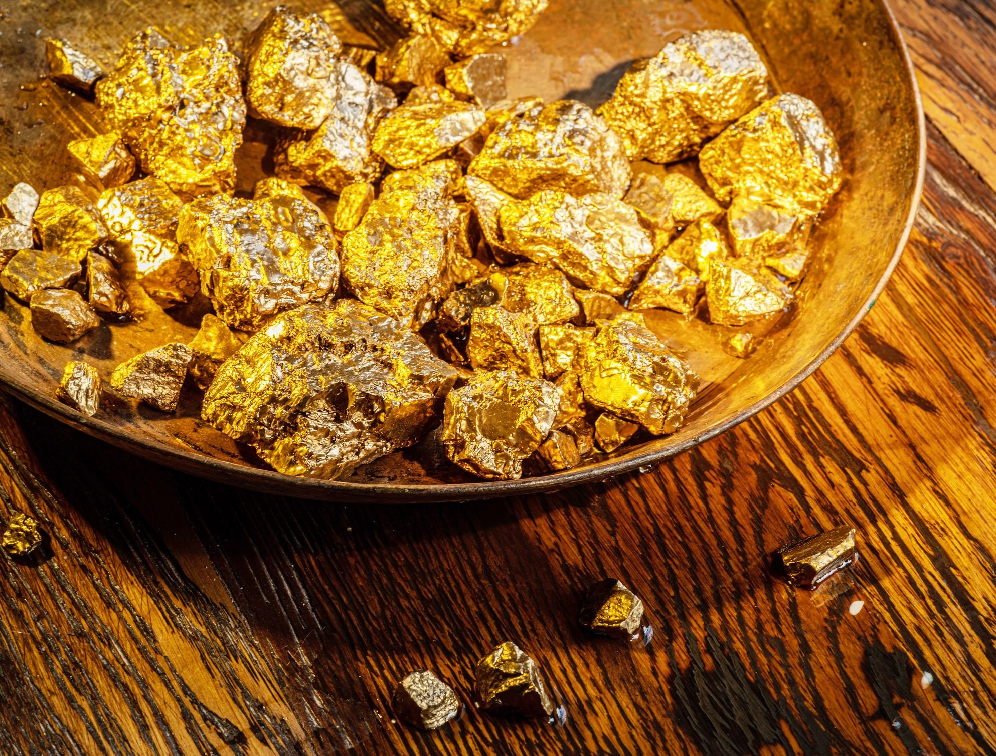 Gold nuggets symbolizing mining output and industry value