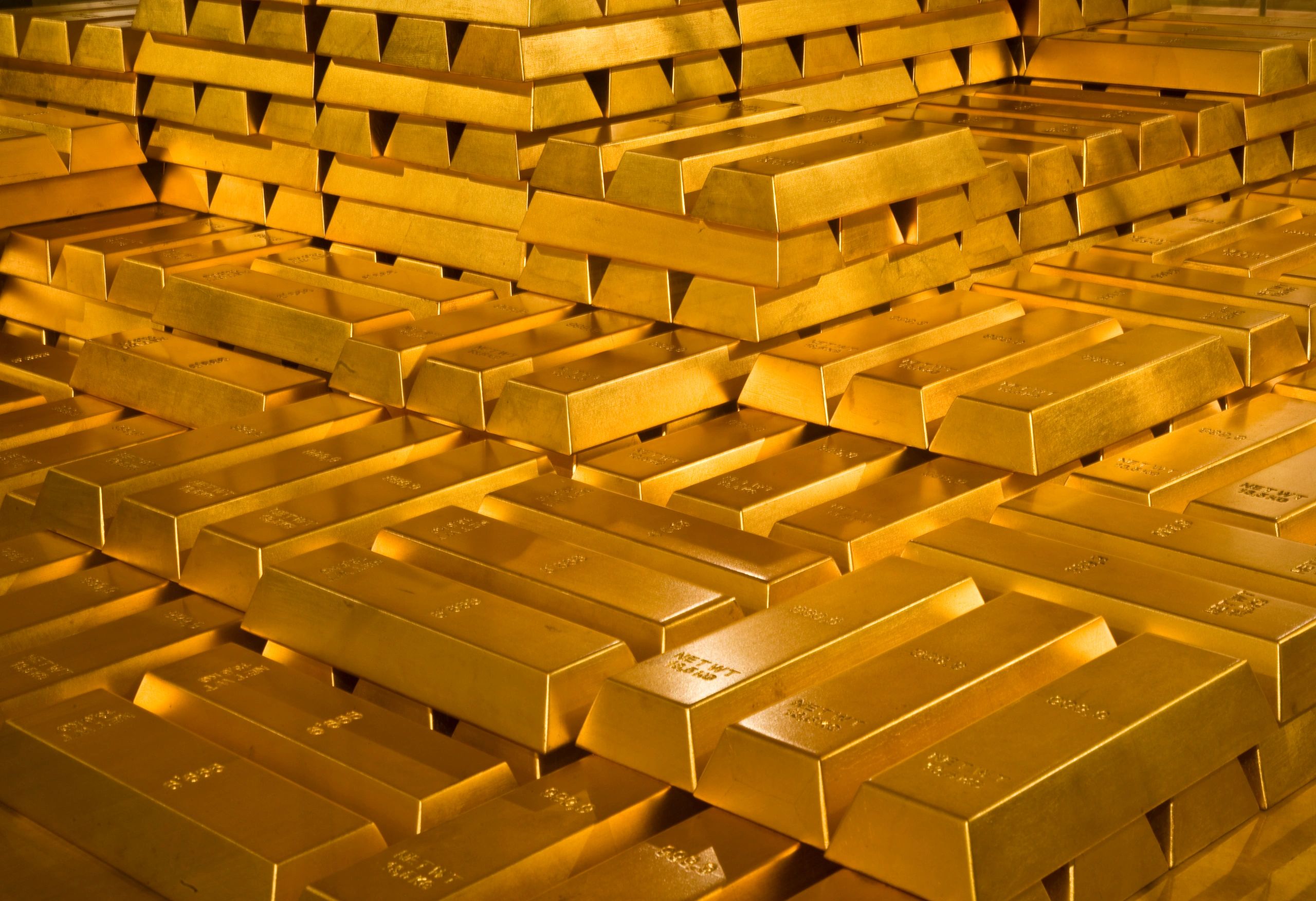 Stacked gold bars representing refined output